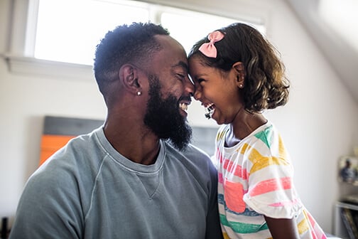 father-and-young-daughter-smiling