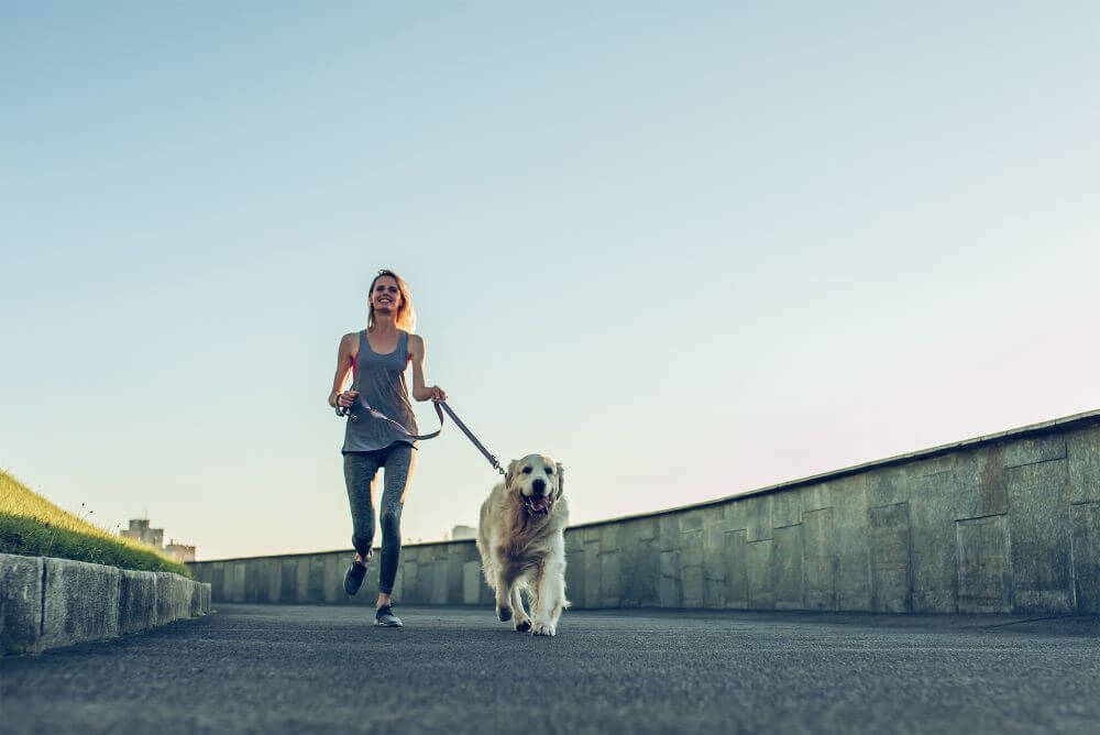 woman-running-with-dog