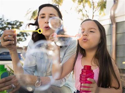 woman-and-child-blowing-bubbles-400x300